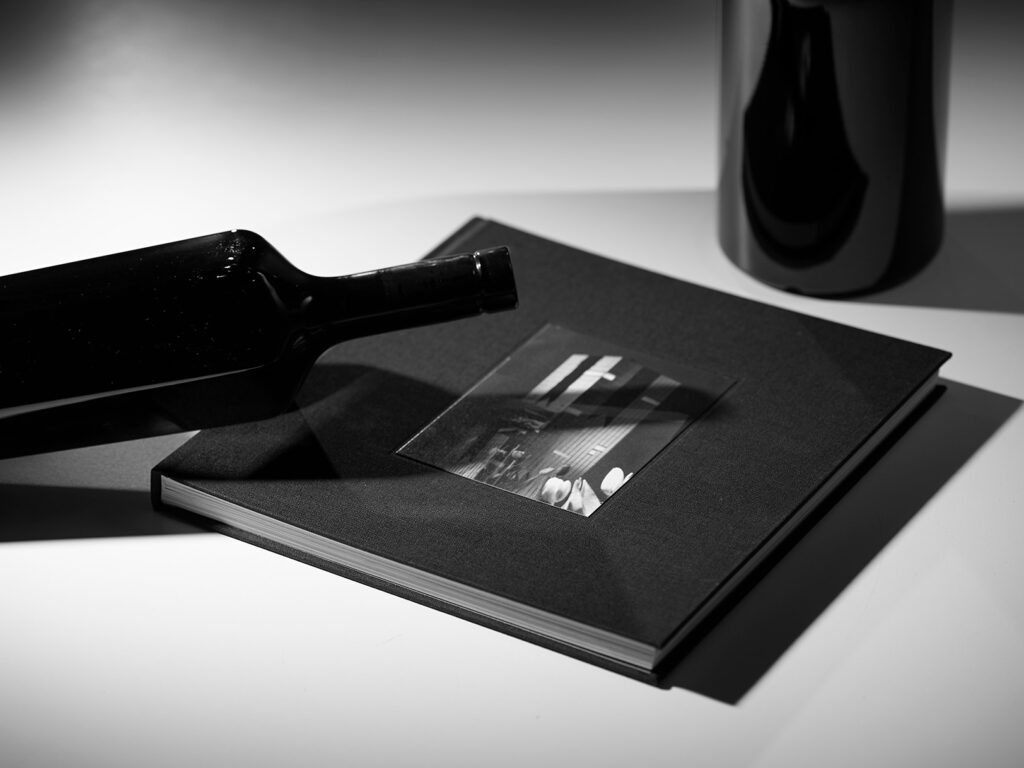 Neotempo wine bottle casting a shadow on a book