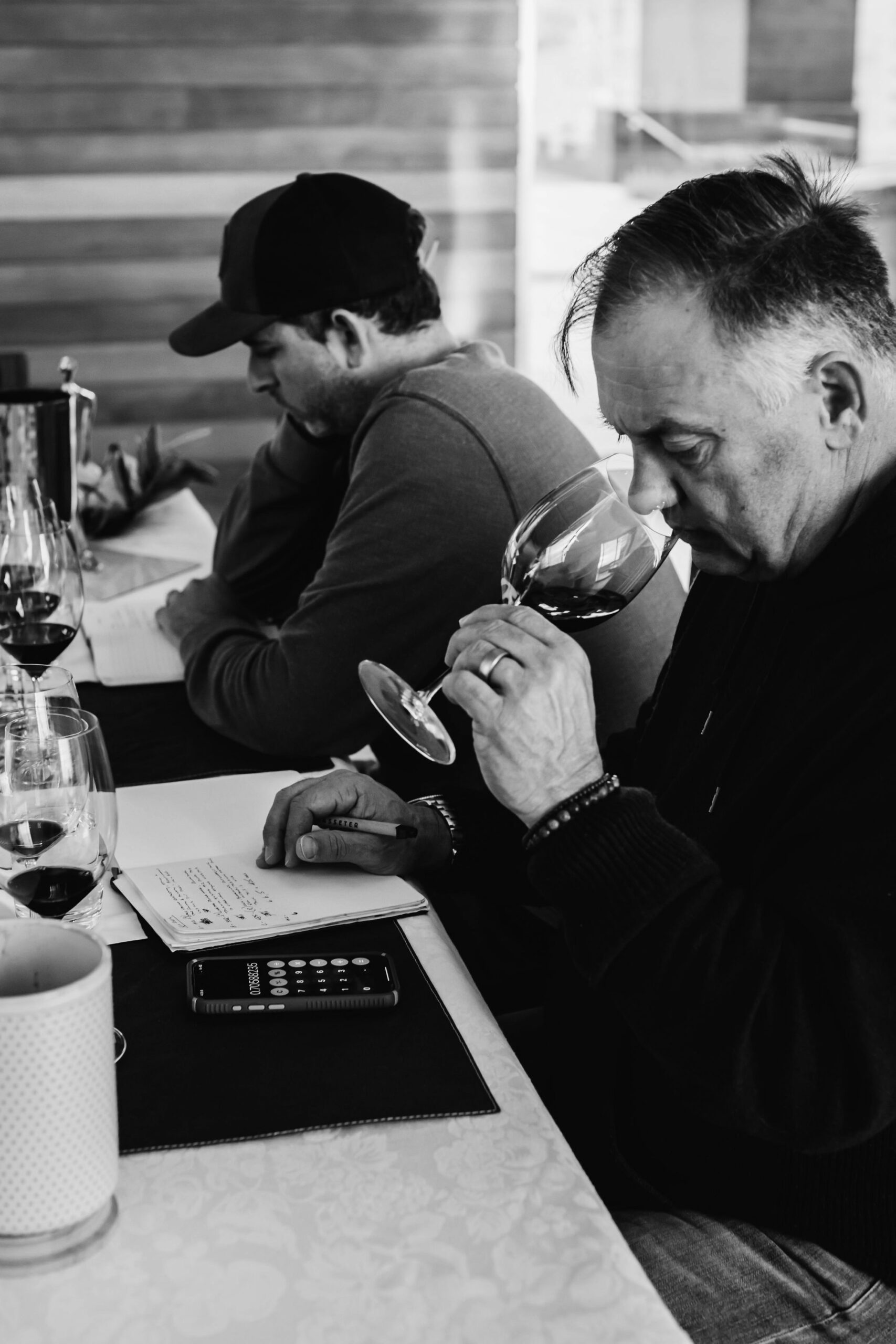 Tony Biagi, winemaker smelling a glass of wine